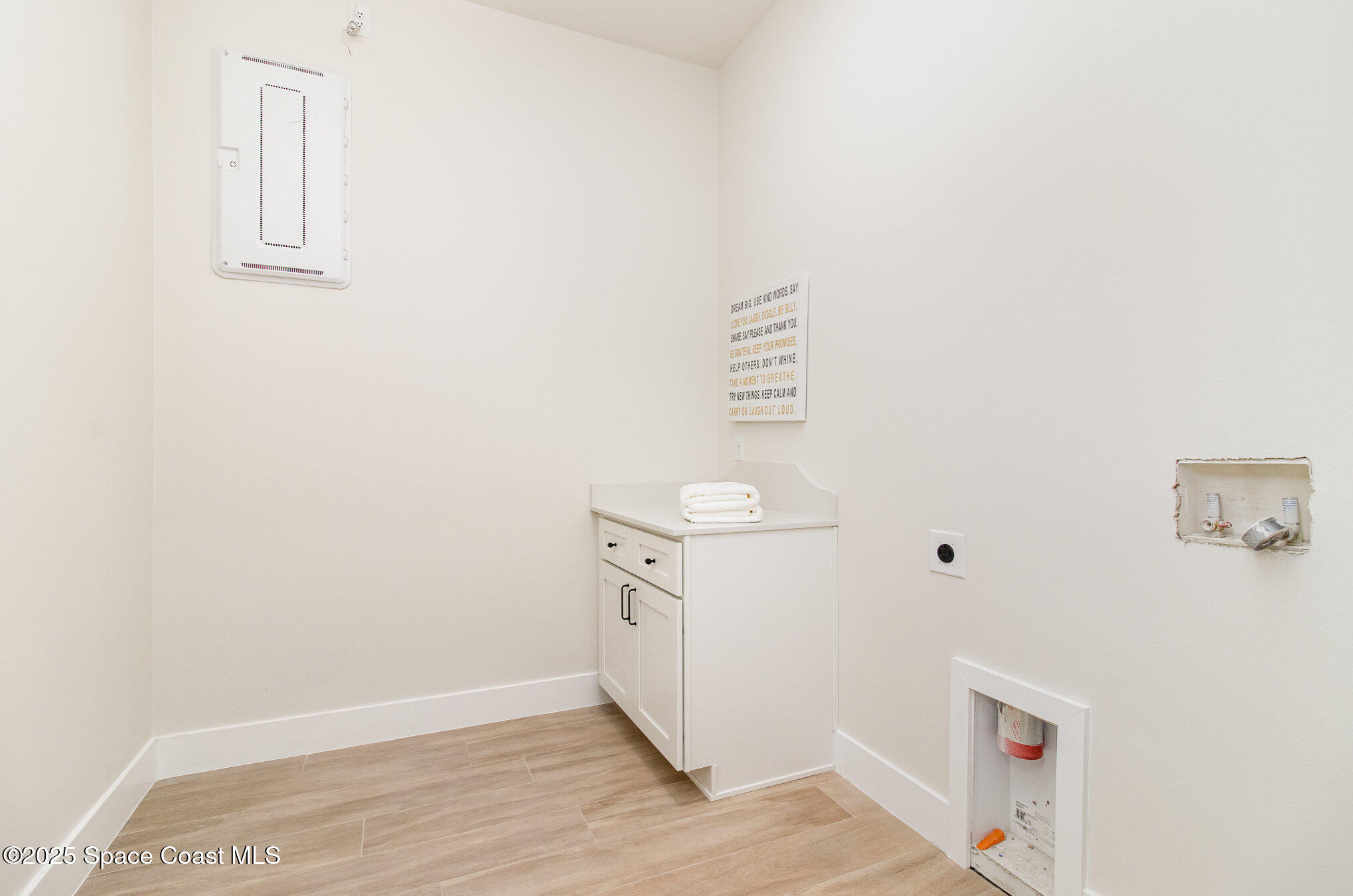 508 Topsail Drive Rockledge, FL 32955 - Photo 26 of 41 a utility room with wooden floor washer and dryer