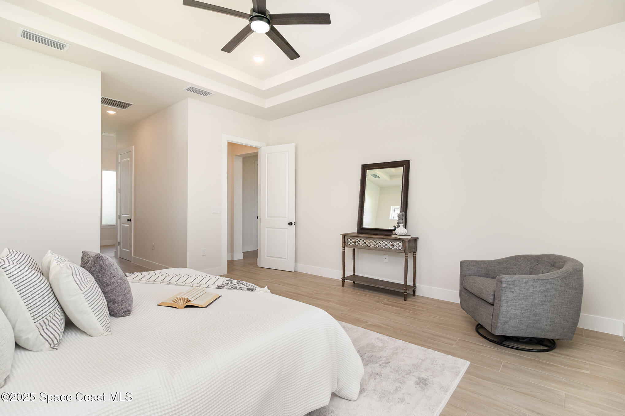 508 Topsail Drive Rockledge, FL 32955 - Photo 28 of 41 a bedroom with a bed a couch and a dresser