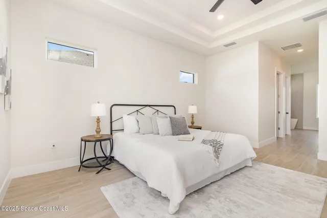 a white bath tub sitting next to a white sink