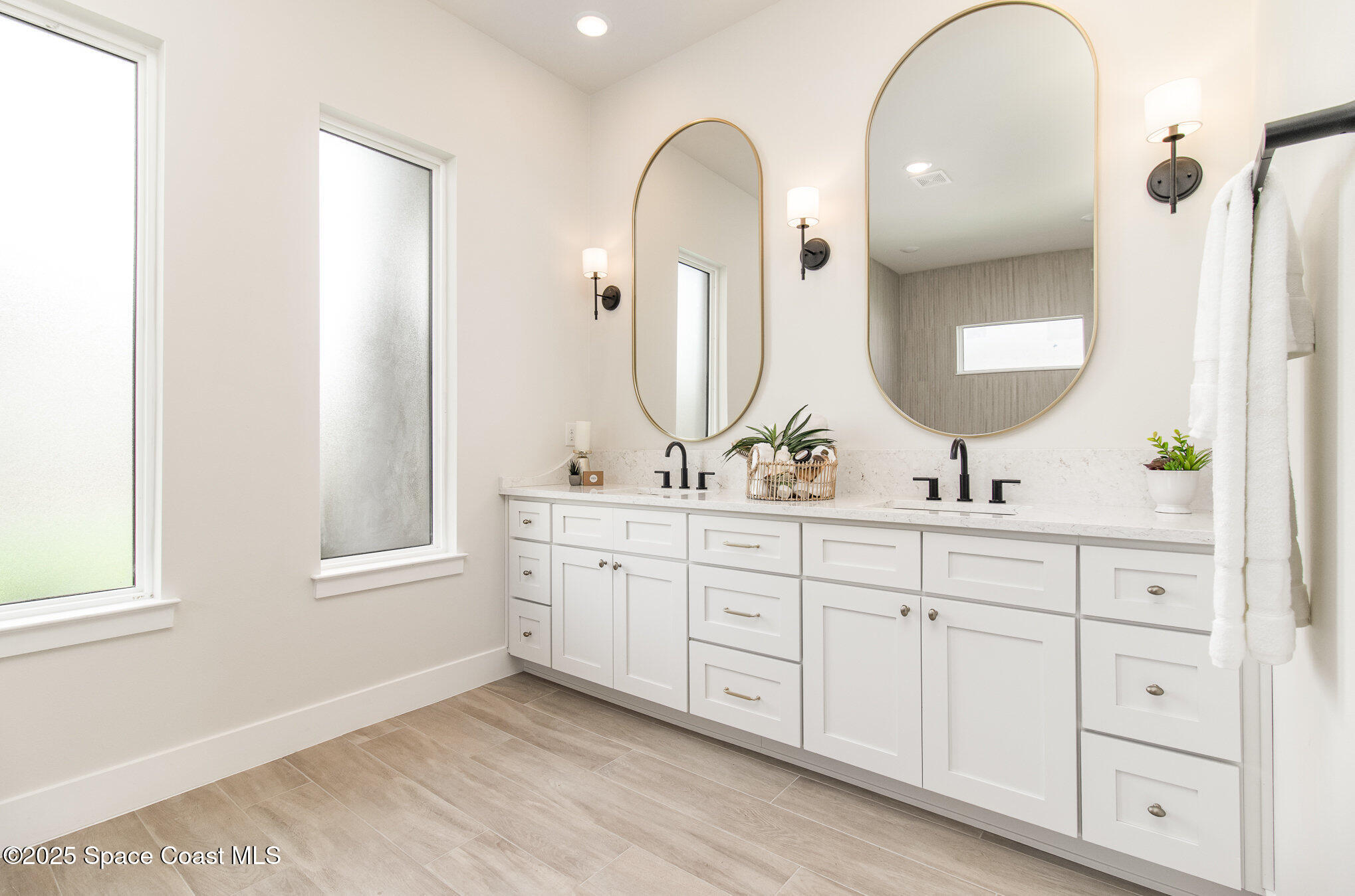 508 Topsail Drive Rockledge, FL 32955 - Photo 31 of 41 a bathroom with a double vanity sink and a mirror