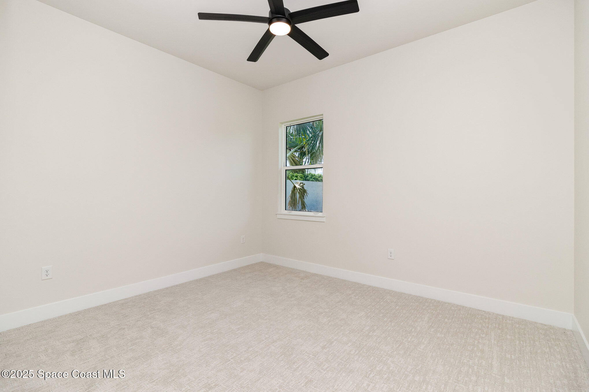 508 Topsail Drive Rockledge, FL 32955 - Photo 34 of 41 an empty room with a window and a fan