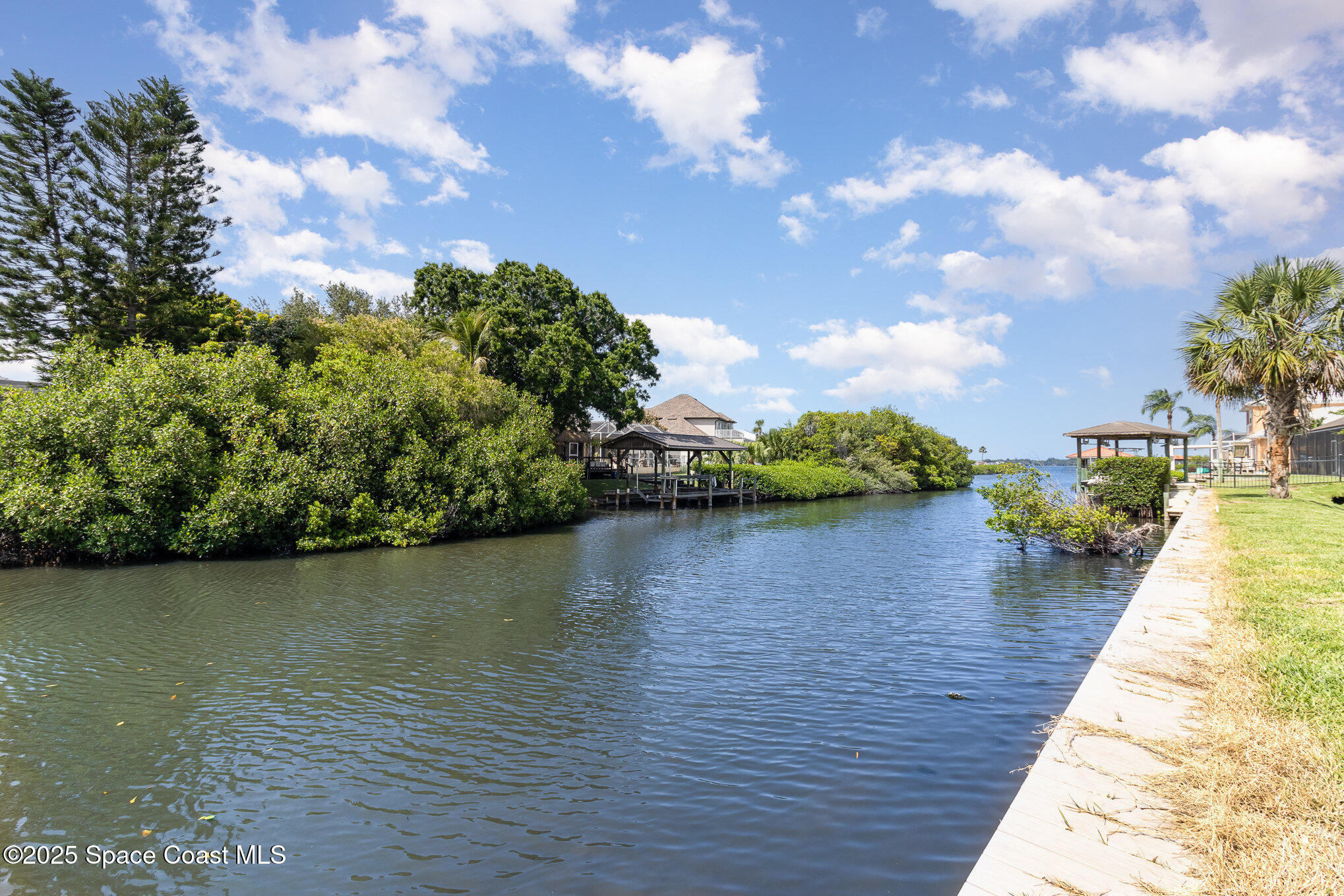 508 Topsail Drive Rockledge, FL 32955 - Photo 8 of 41 a view of a lake with houses