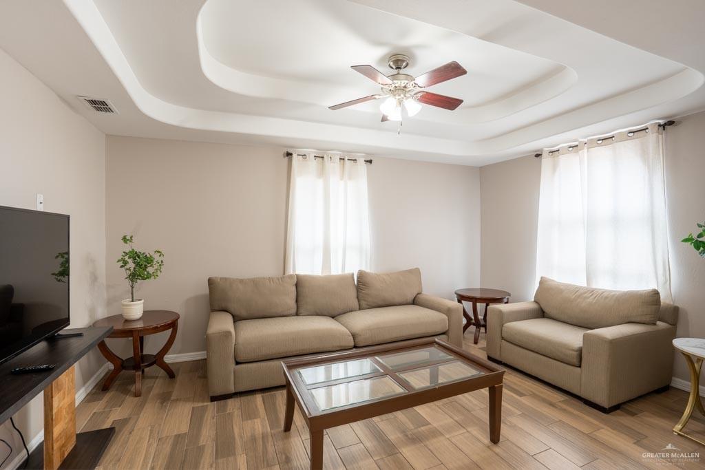 5108 South 33rd Street McAllen, TX 78503 - Photo 2 of 17 a living room with furniture and a flat screen tv
