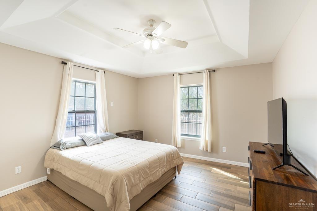 5108 South 33rd Street McAllen, TX 78503 - Photo 7 of 17 a bedroom with a bed and a flat tv screen on the dresser