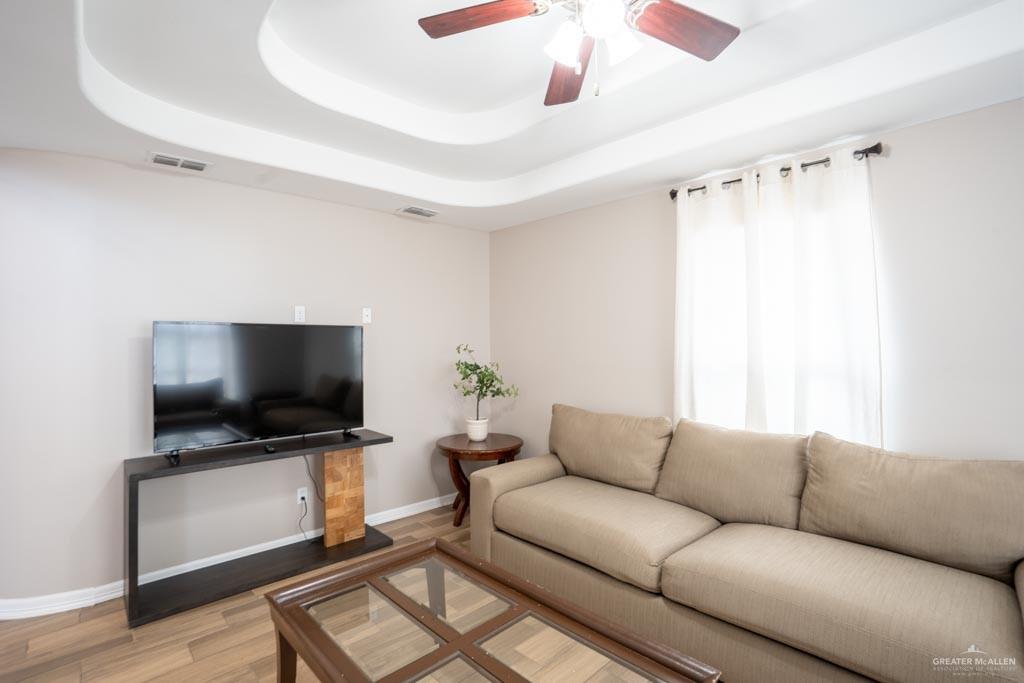 5108 South 33rd Street McAllen, TX 78503 - Photo 9 of 17 a living room with furniture and a flat screen tv