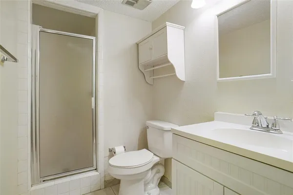 a bathroom with a sink toilet and vanity