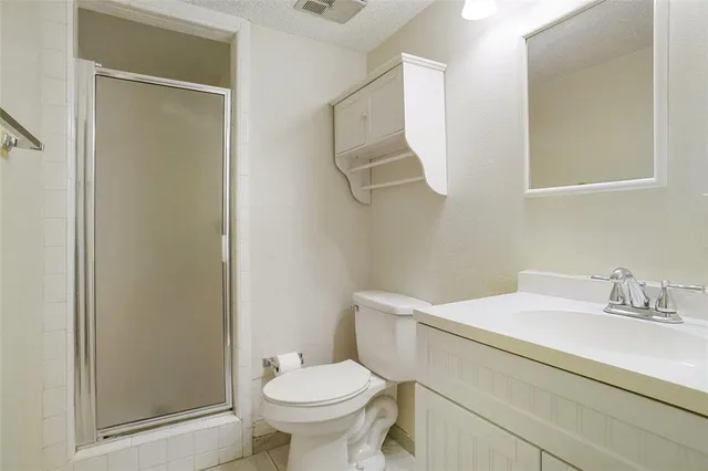 a bathroom with a sink toilet and vanity