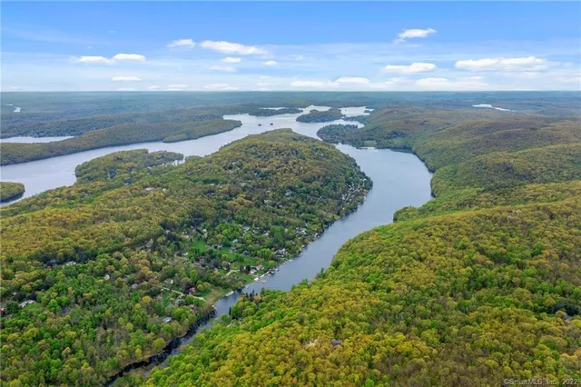 a view of a lake with a yard