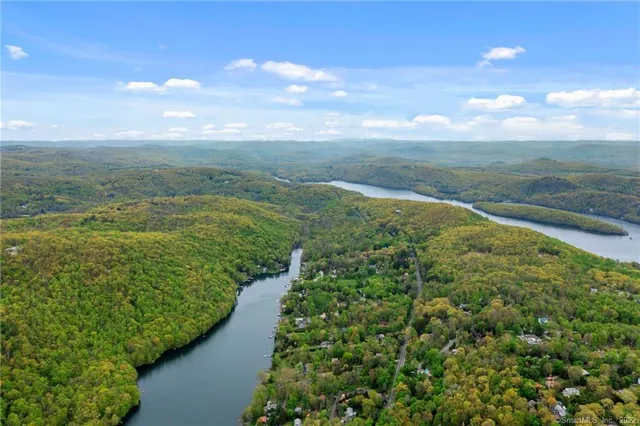 a view of a lake with a big yard