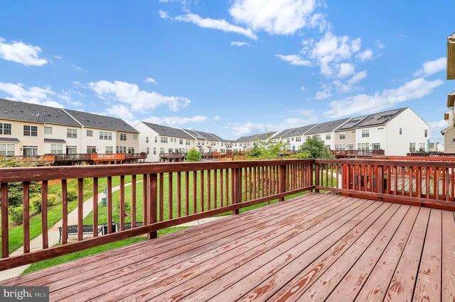 a view of balcony with wooden floor