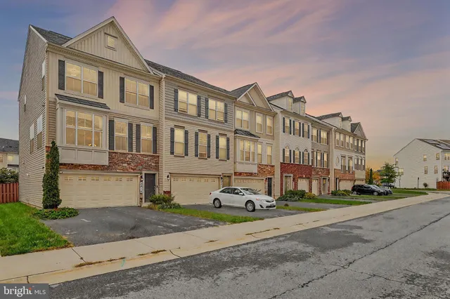 a city street lined with buildings and trees