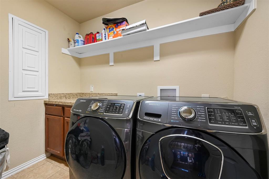 14815 Frisco Ranch Drive Little Elm, TX 75068 - Photo 30 of 40 a utility room with dryer and washer