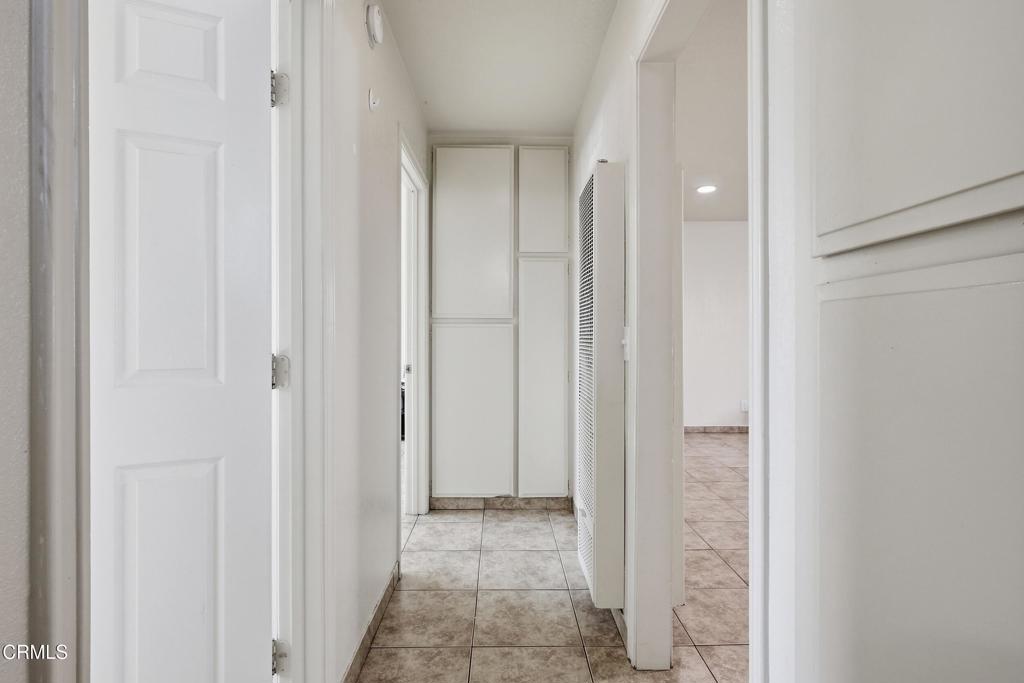 1920 North H Street, Unit 133 Oxnard, CA 93036 - Photo 11 of 14 a view of a hallway with a door