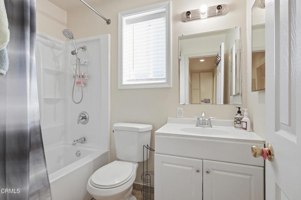 1920 North H Street, Unit 133 Oxnard, CA 93036 - Photo 12 of 14 a bathroom with a sink a toilet and shower