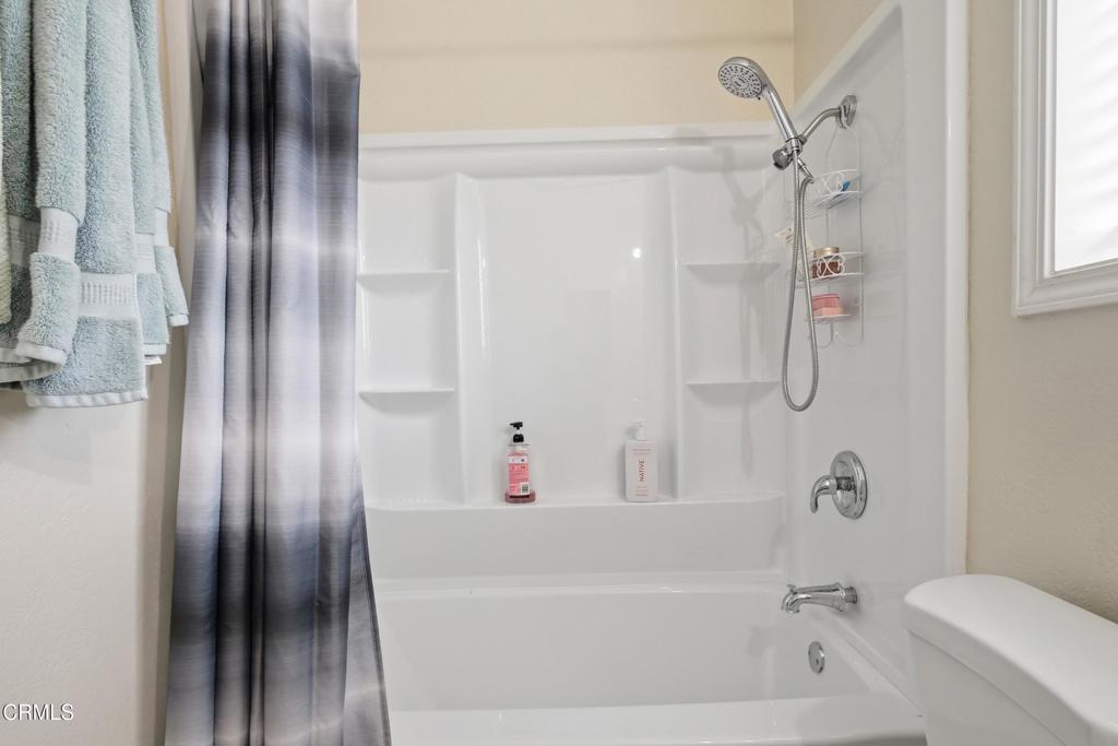 1920 North H Street, Unit 133 Oxnard, CA 93036 - Photo 13 of 14 a bathroom with a bathtub and a shower