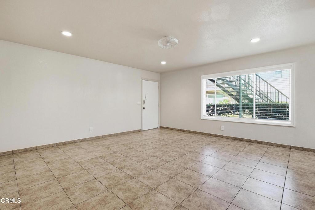 1920 North H Street, Unit 133 Oxnard, CA 93036 - Photo 4 of 14 a view of an empty room with a window