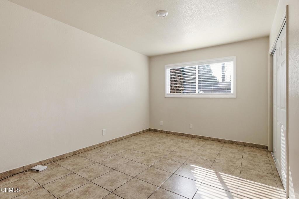 1920 North H Street, Unit 133 Oxnard, CA 93036 - Photo 9 of 14 an empty room with windows