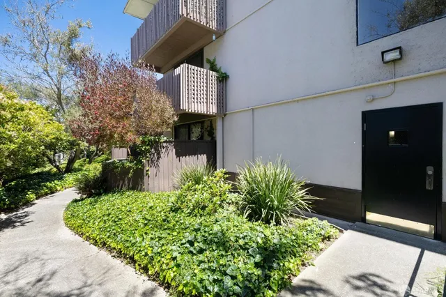 a view of a kitchen with a sink and chandelier