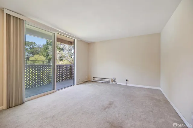 a kitchen with stainless steel appliances a refrigerator a stove a sink and white cabinets