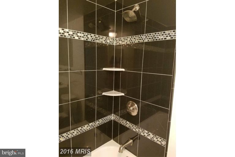 2016 37th Street Southeast, Unit 202 Washington, DC 20020 - Photo 3 of 21 Renovated bathroom