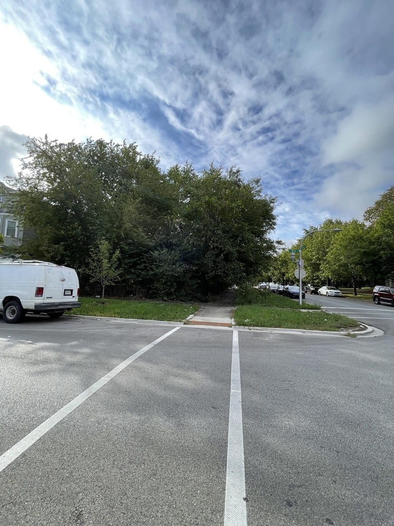 a view of a parked car with city street