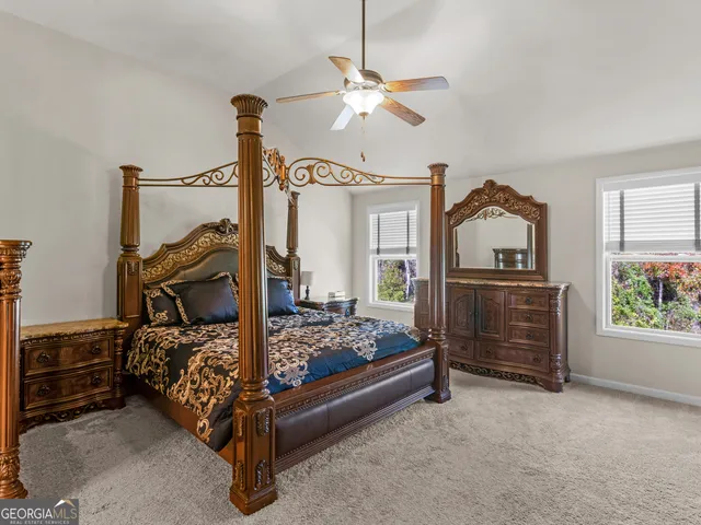 a bedroom with bed and window