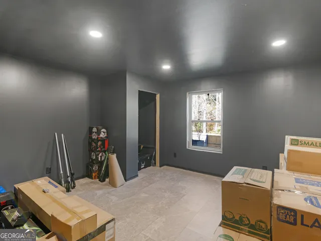 a large room with lots of furniture and a projector