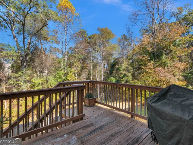 a view of wooden balcony with wooden fence