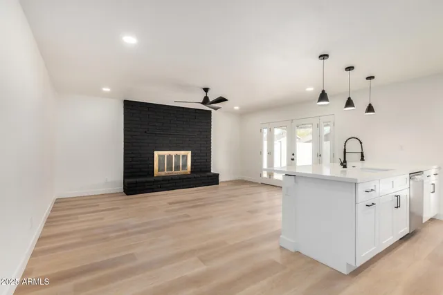 a kitchen with sink and cabinets