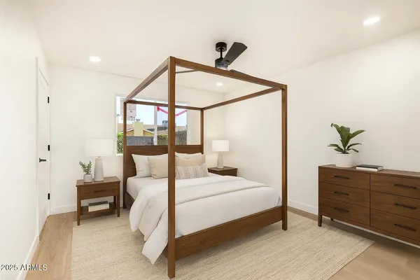 a bedroom with a bed and a dresser