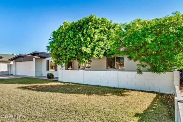 front view of a house with a yard