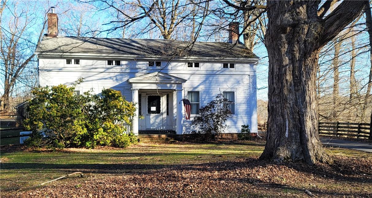 190-192 Yantz Road Red Hook, NY 12571 - Photo 1 of 1 a front view of a house with a yard balcony and trees