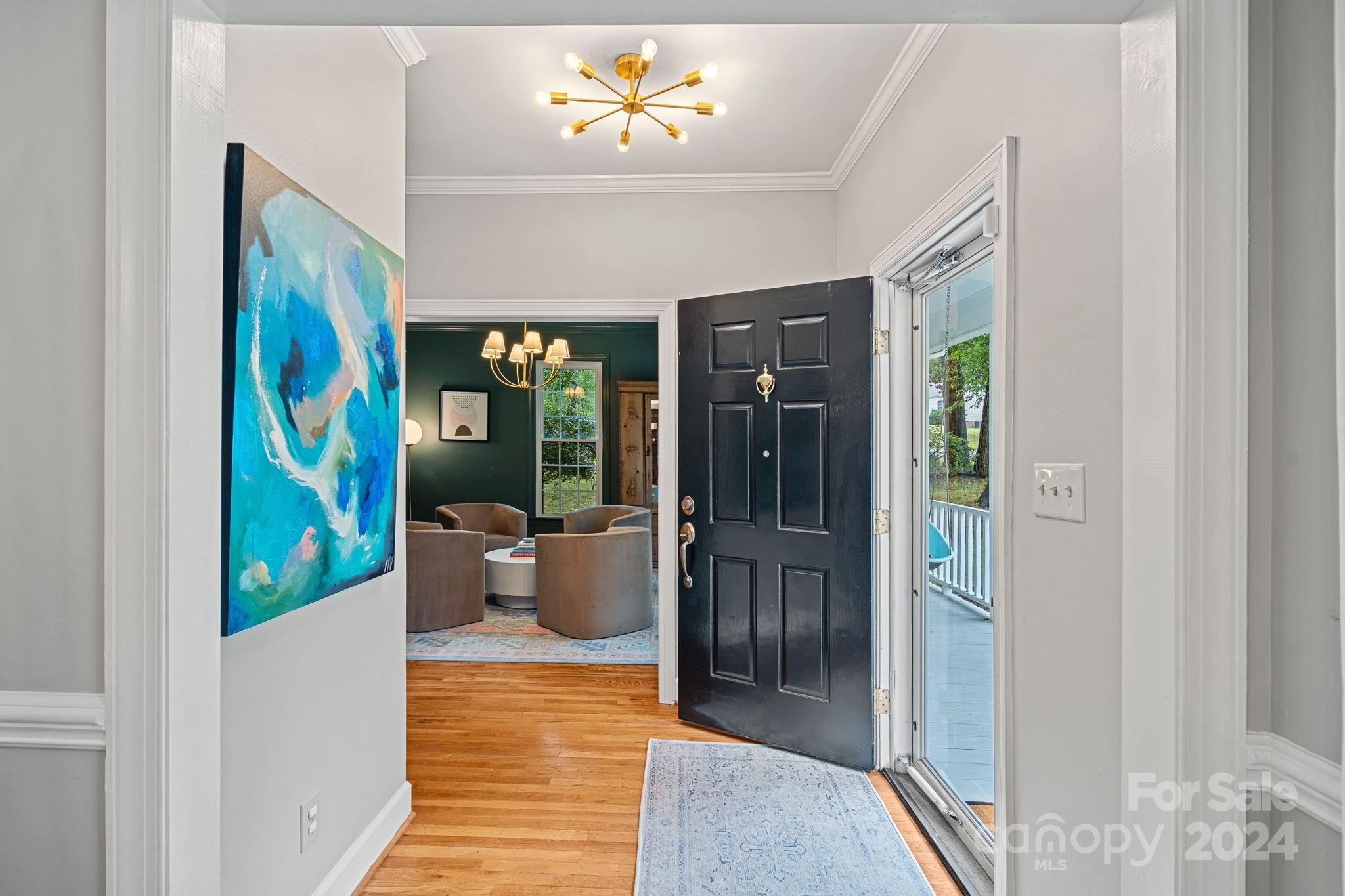 3000 Heathgate Road Charlotte, NC 28226 - Photo 15 of 48 a view of a hallway with wooden floor and dining room