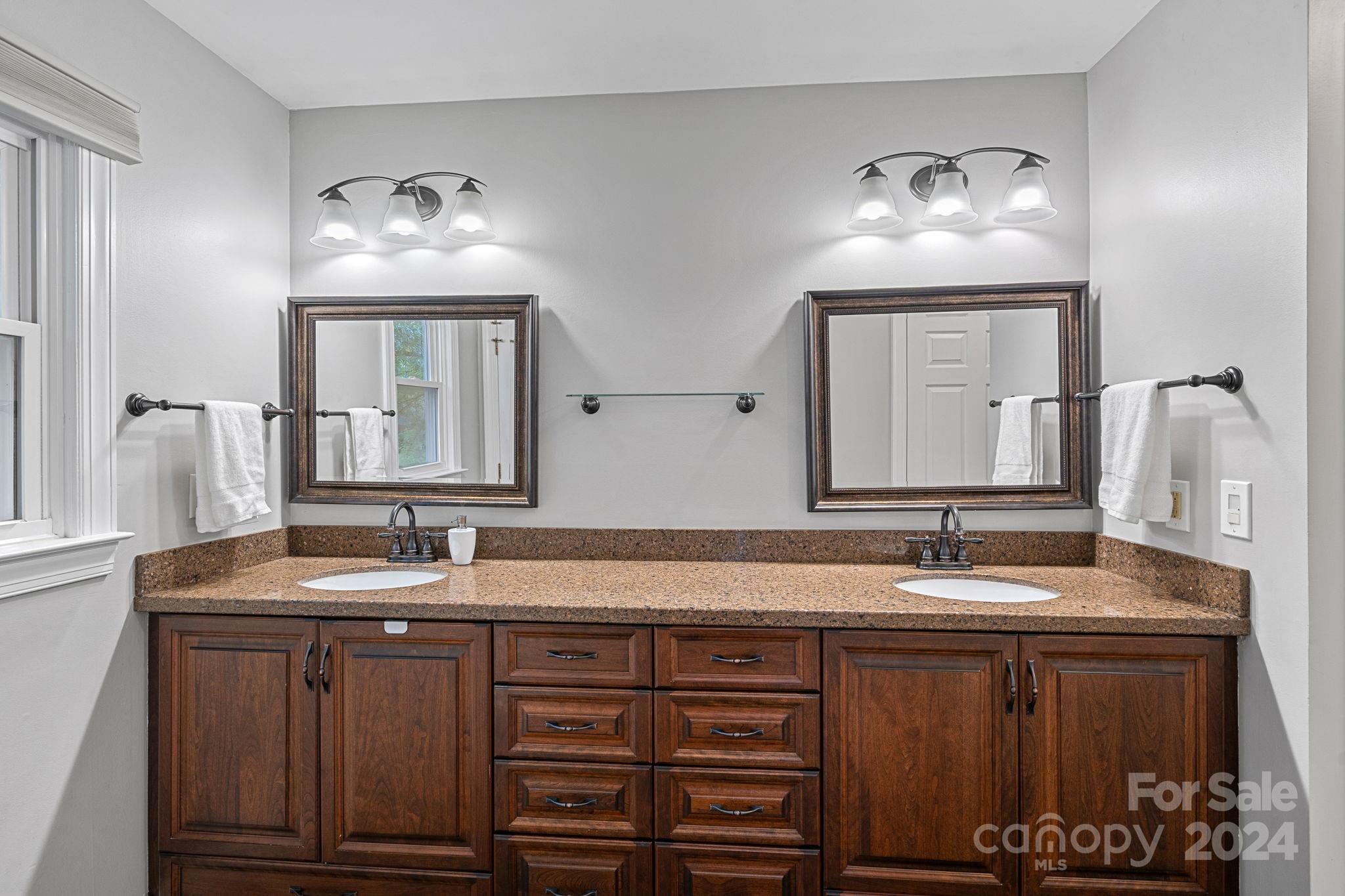 3000 Heathgate Road Charlotte, NC 28226 - Photo 19 of 48 a bathroom with a double vanity sink and a mirror