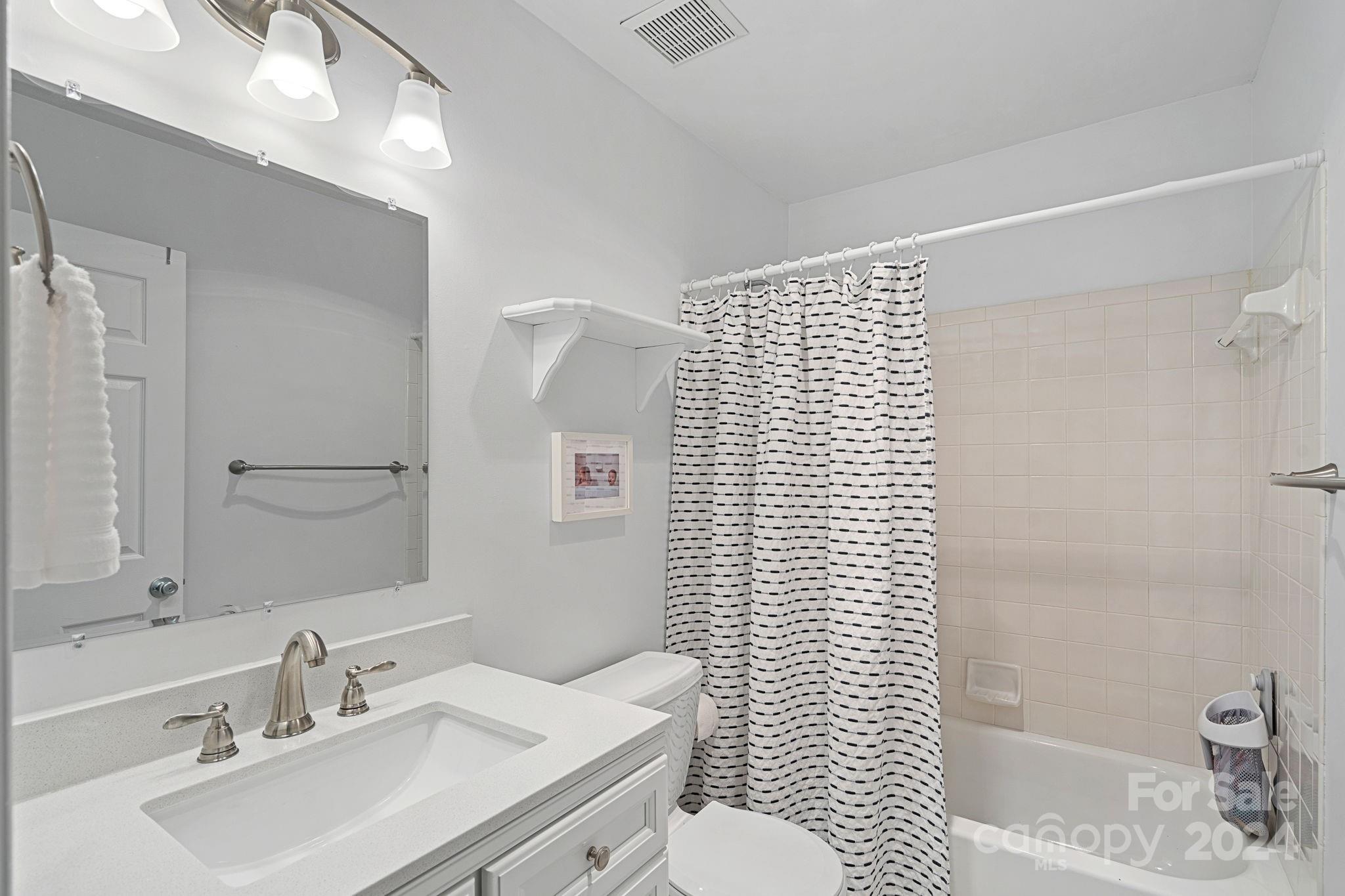 3000 Heathgate Road Charlotte, NC 28226 - Photo 23 of 48 a bathroom with a sink toilet and shower
