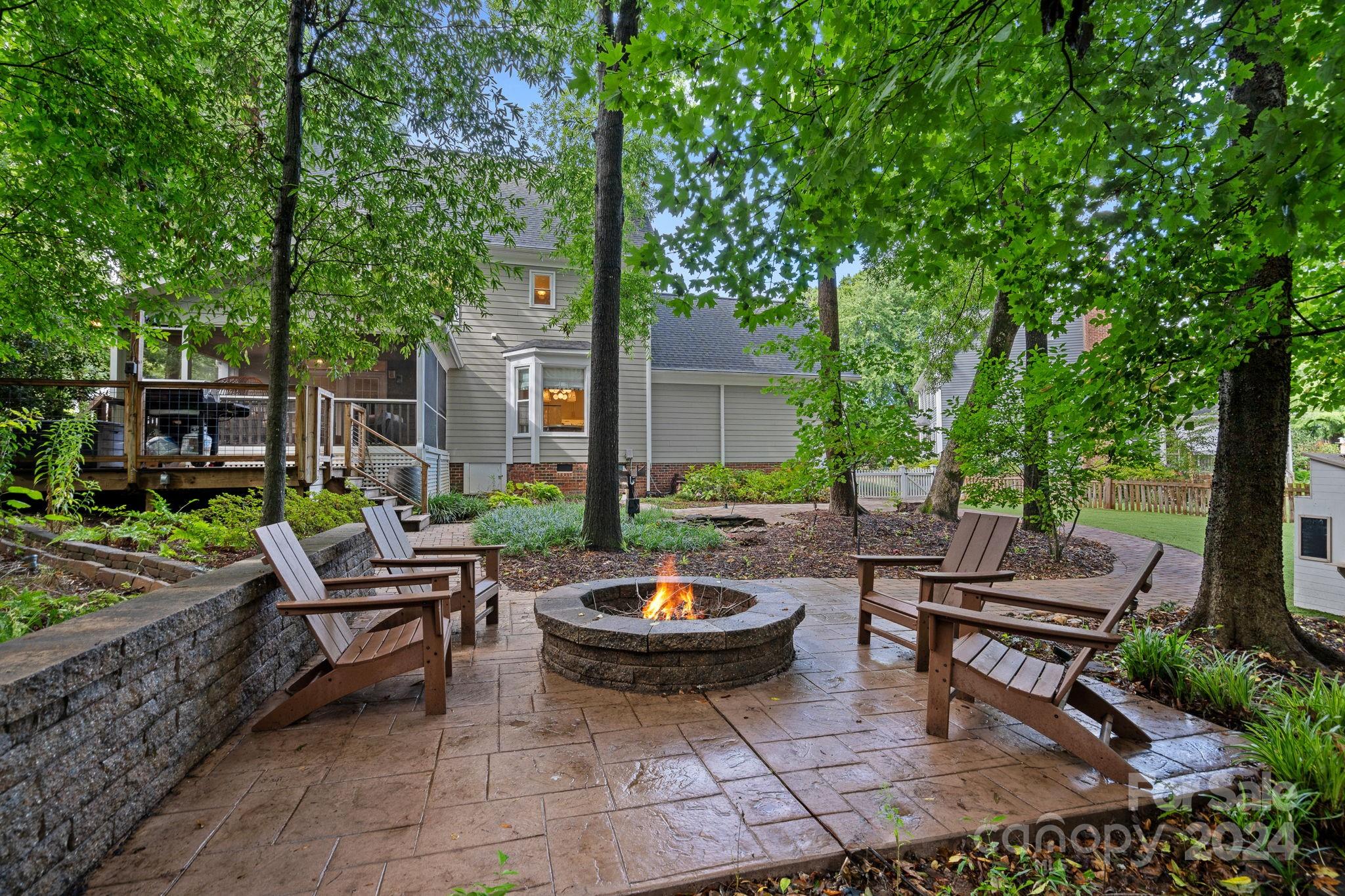 3000 Heathgate Road Charlotte, NC 28226 - Photo 33 of 48 a backyard of a house with fire pit and outdoor seating