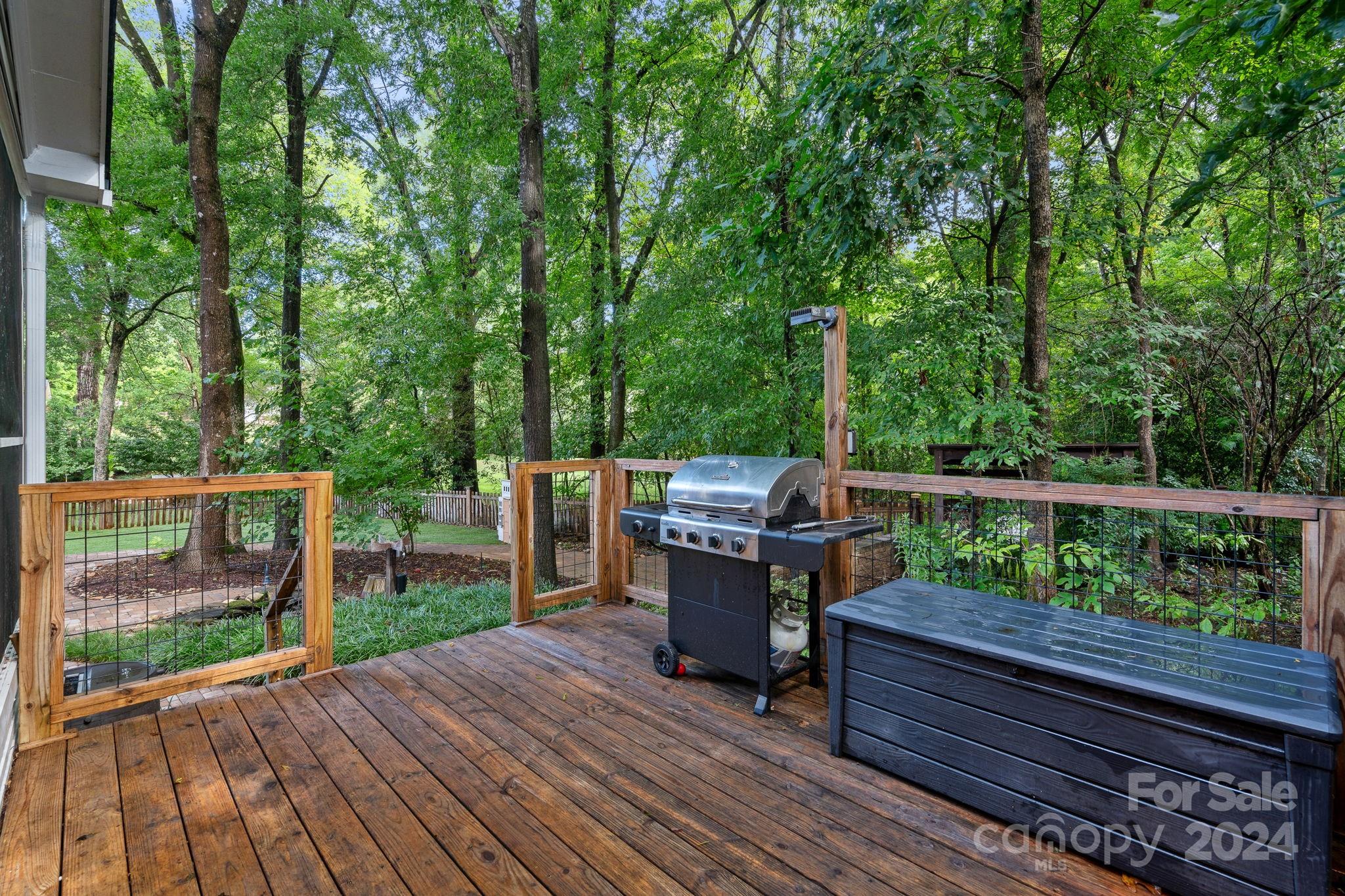 3000 Heathgate Road Charlotte, NC 28226 - Photo 35 of 48 a view of a deck with chairs a barbeque with wooden floor and fence