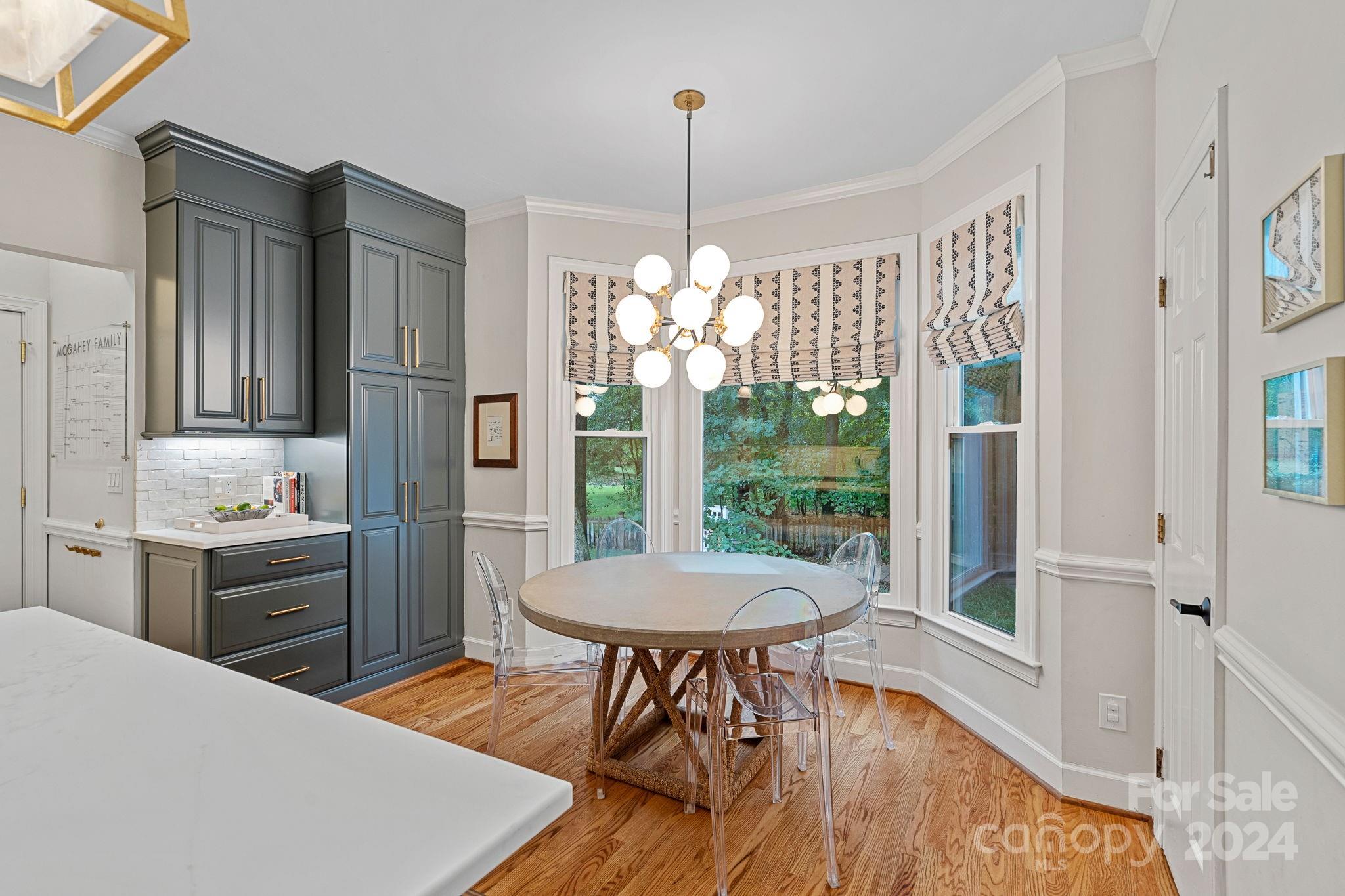 3000 Heathgate Road Charlotte, NC 28226 - Photo 6 of 48 a kitchen with a table chairs stove and refrigerator