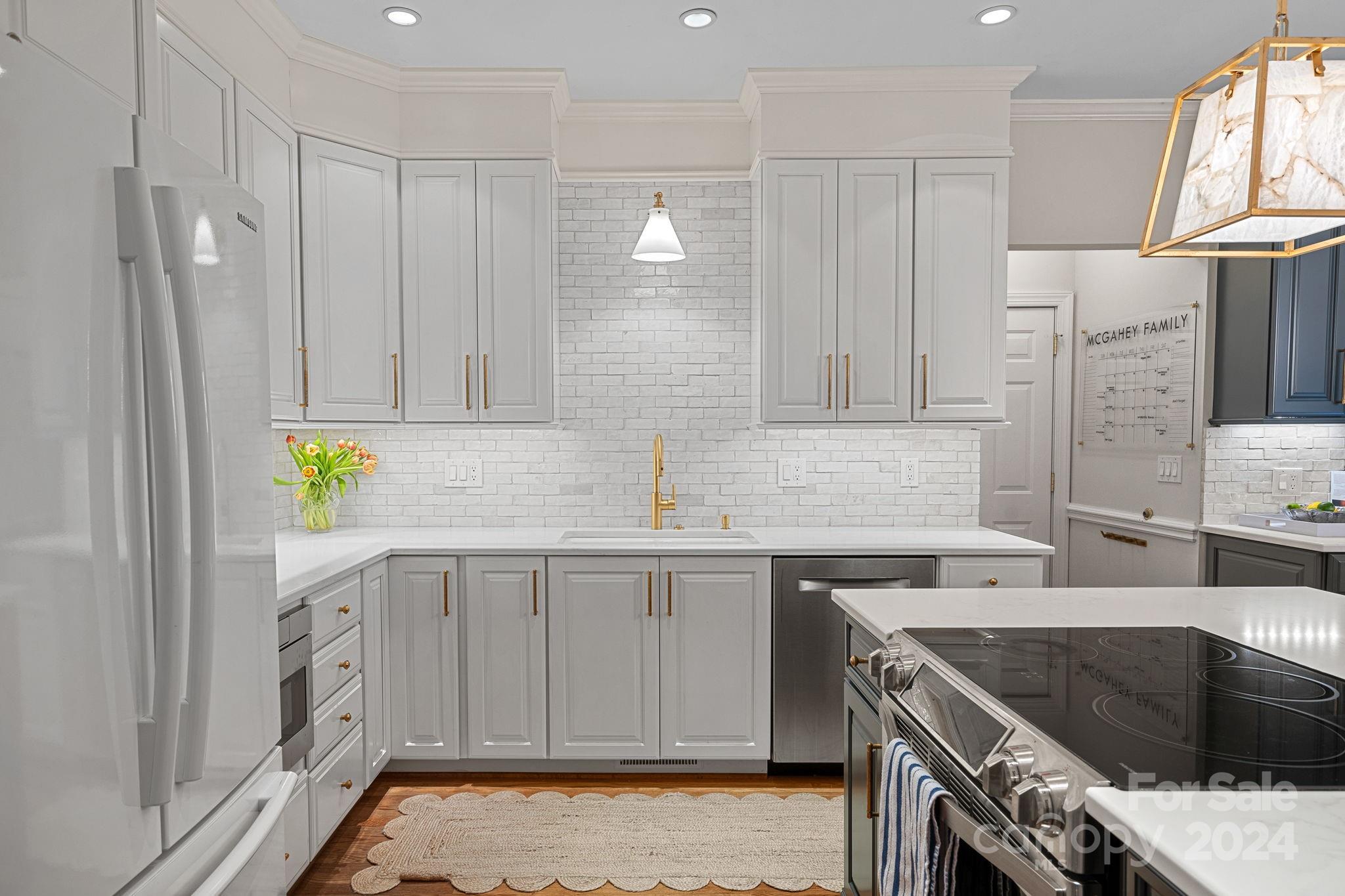 3000 Heathgate Road Charlotte, NC 28226 - Photo 8 of 48 a kitchen that has a sink and a stove in it