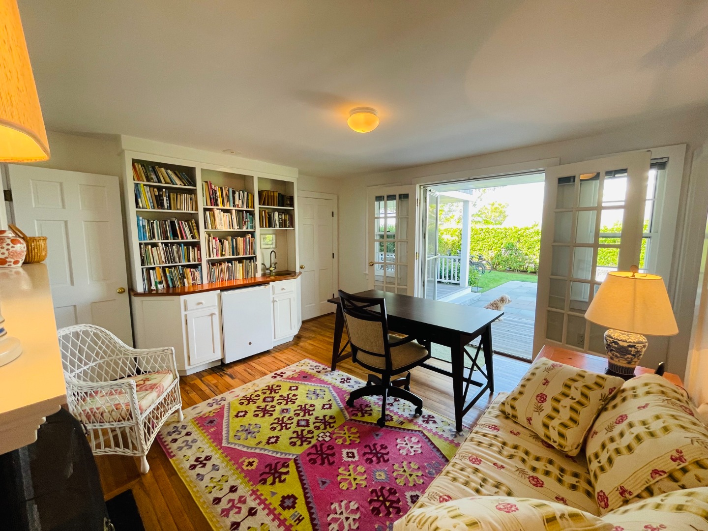 76 Baxter Road Nantucket, MA 02554 - Photo 10 of 25 a bedroom with a bed and wooden floor