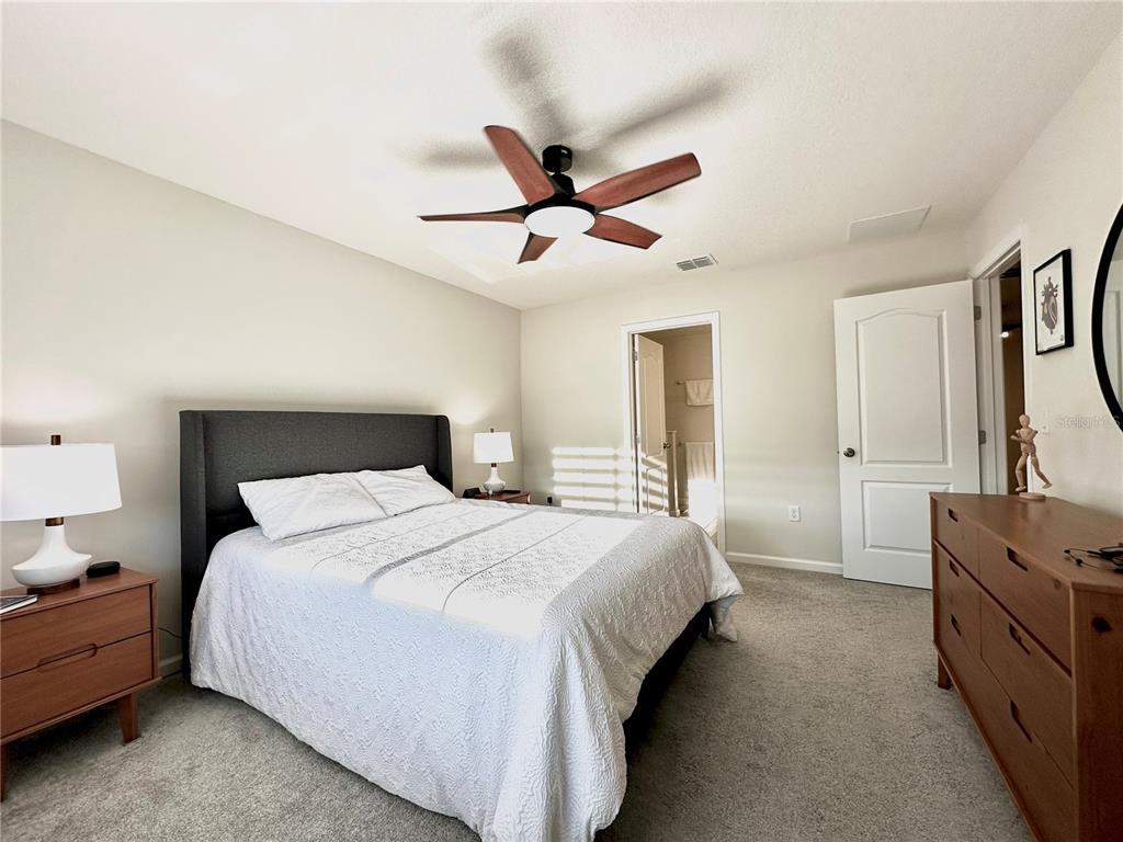 2767 North Narcoossee Road, Unit 2767 St. Cloud, FL 34771 - Photo 8 of 19 a bedroom with bed and window