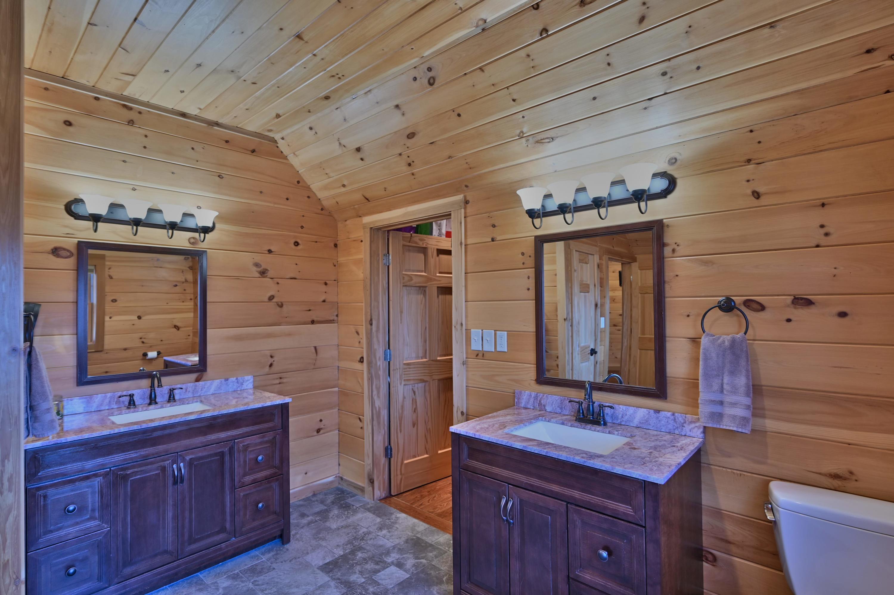 400 Summit Woods Road Moscow, PA 18444 - Photo 49 of 72 a spacious bathroom with a granite countertop sink and a mirror