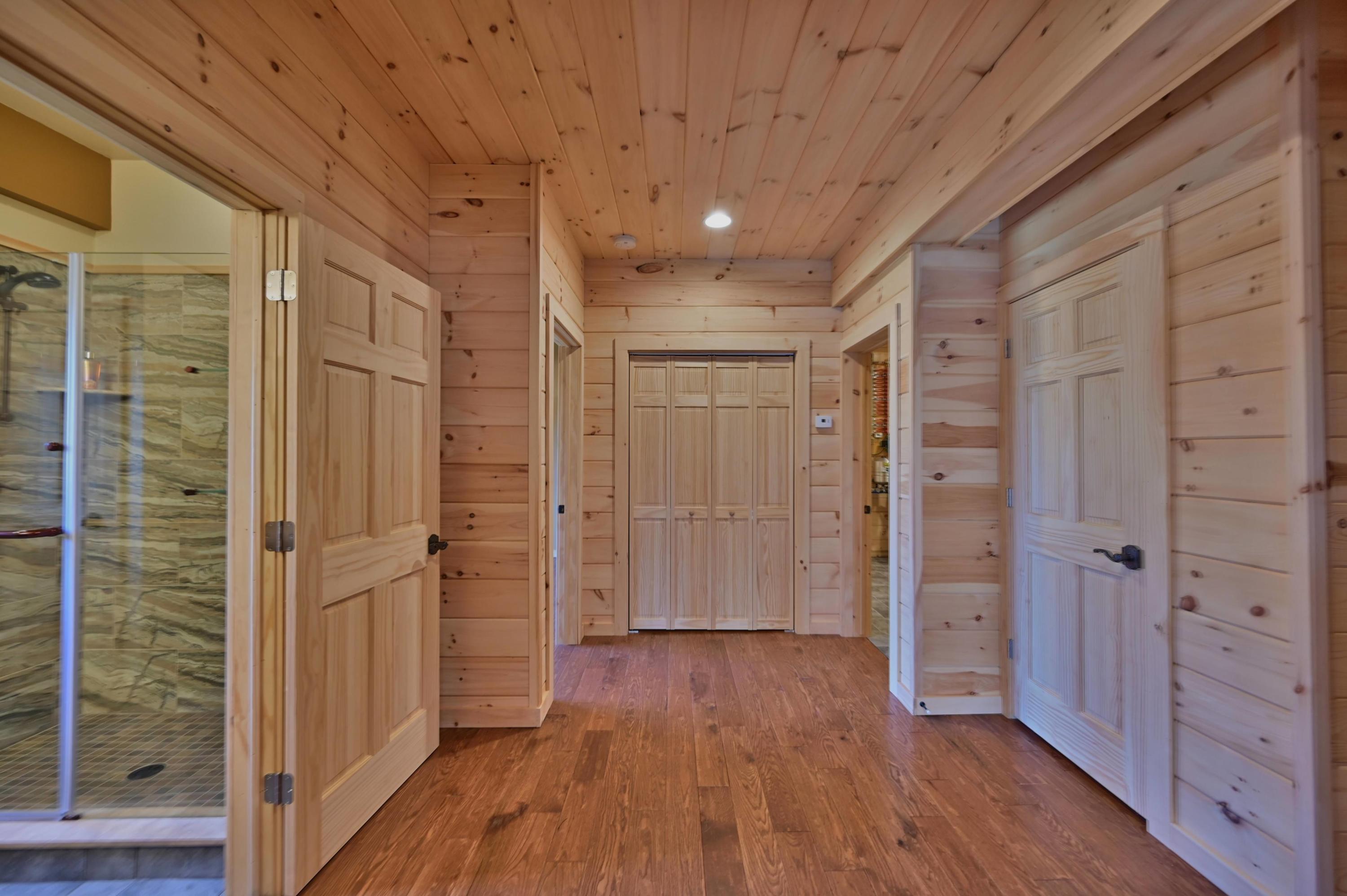 400 Summit Woods Road Moscow, PA 18444 - Photo 56 of 72 a empty room with wooden floor and closet area