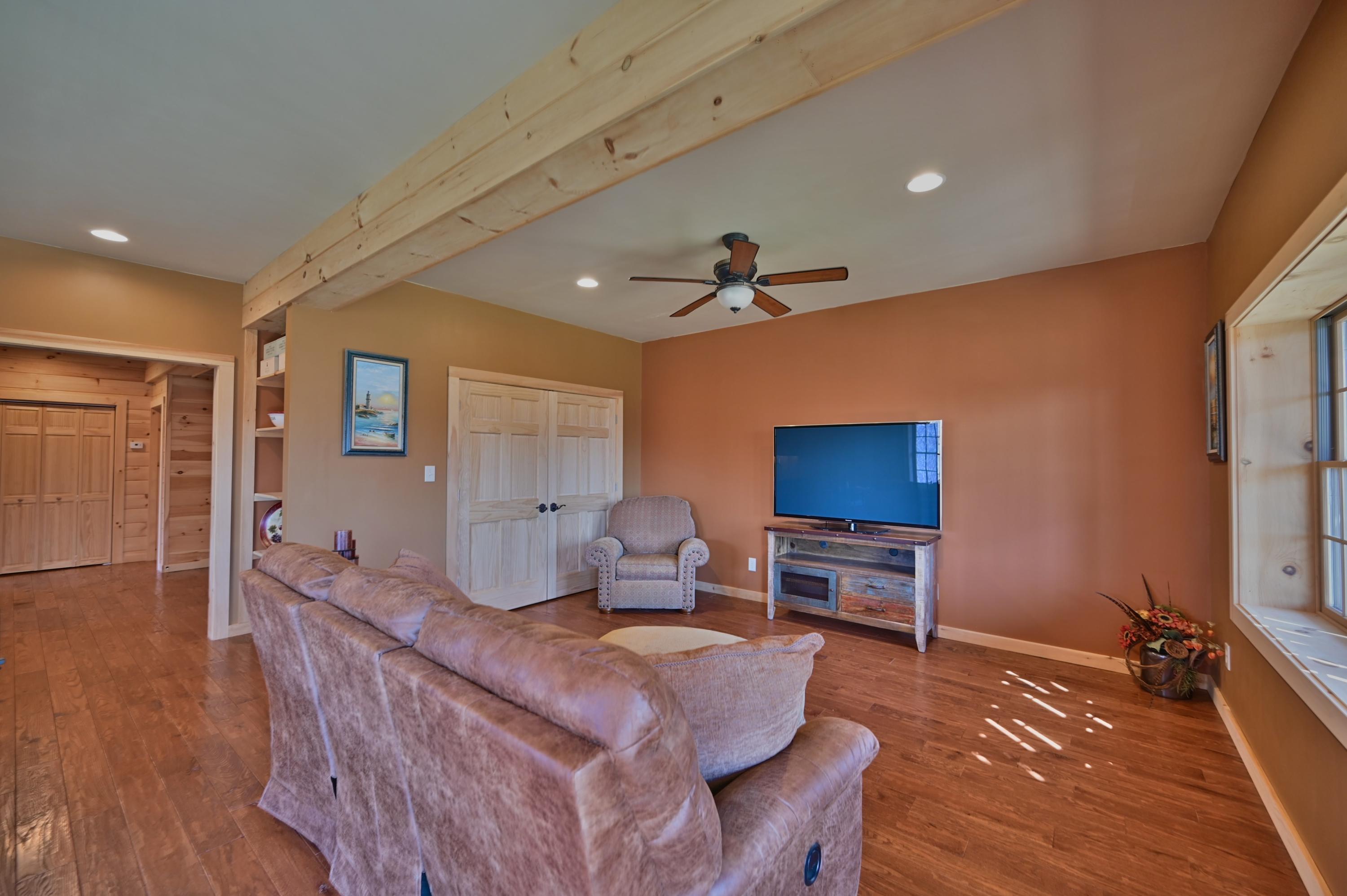 400 Summit Woods Road Moscow, PA 18444 - Photo 59 of 72 a living room with furniture and a flat screen tv