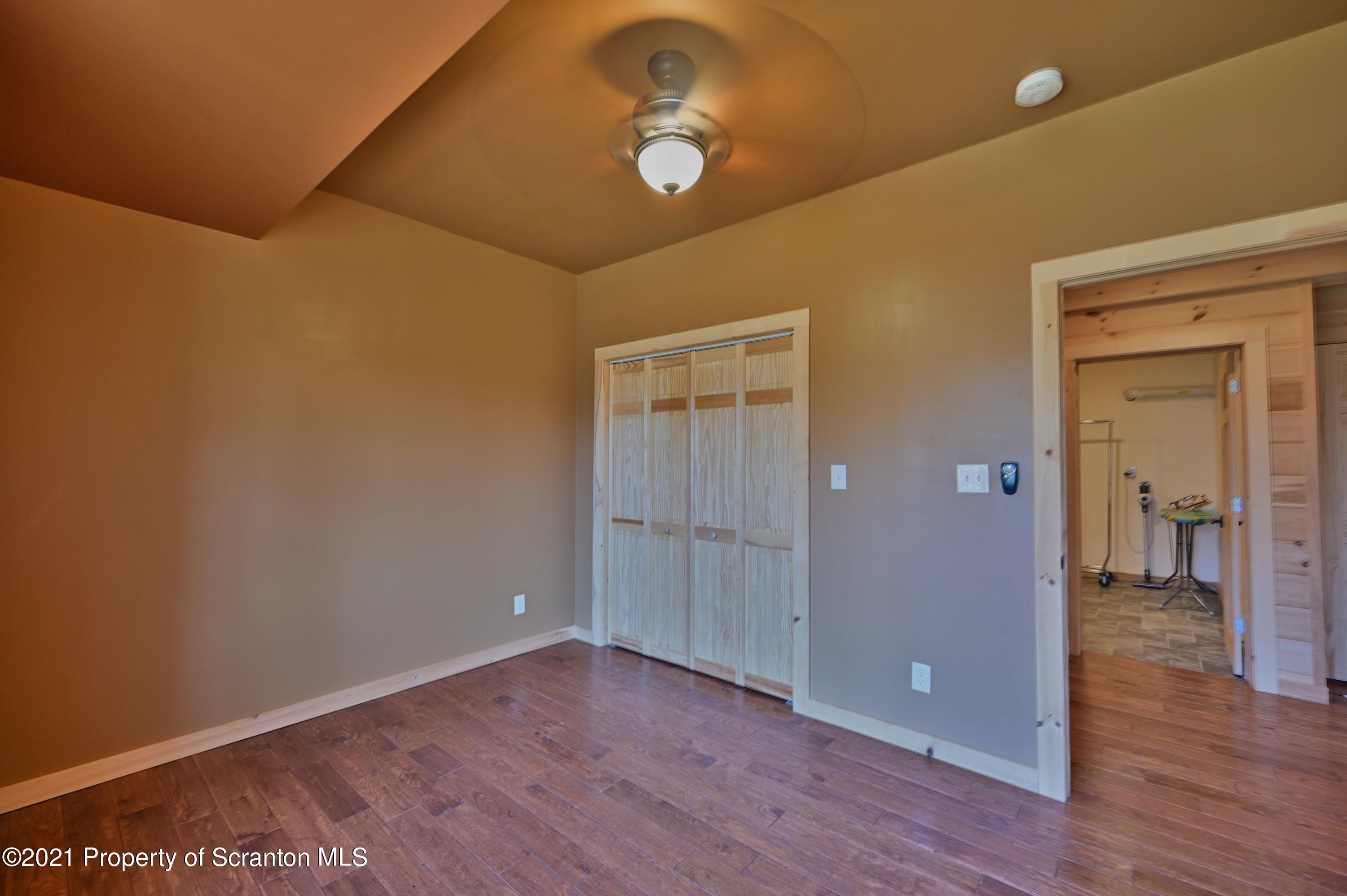 400 Summit Woods Road Moscow, PA 18444 - Photo 64 of 72 wooden floor in an empty room
