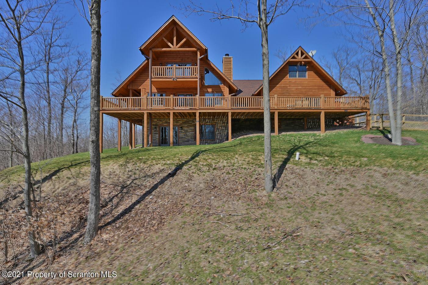 400 Summit Woods Road Moscow, PA 18444 - Photo 8 of 72 a view of a house with a yard