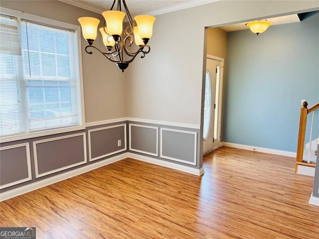 543 Saddle Ridge Drive Bethlehem, GA 30620 - Photo 9 of 36 a view of empty room with wooden floor