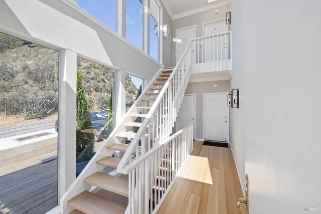 a view of entryway with wooden floor