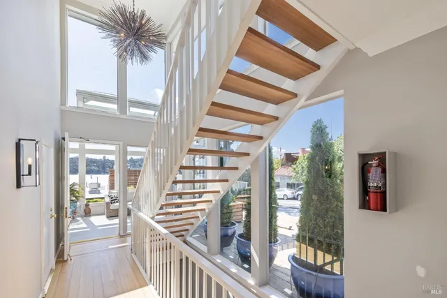 a view of a living room and balcony