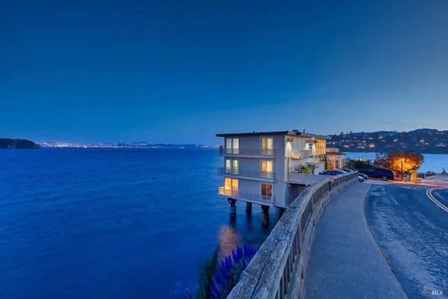 a view of a balcony with chairs